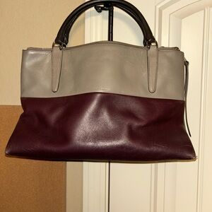 Coach Borough bag in a burgundy and grey colorblock leather design